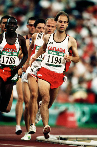Canada's Joel Bourgeois (1194) competes in the 3000m steeplechase at the 1996 Olympic games in Atlanta. (CP PHOTO/ COA/Claus Andersen)