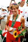 Canada's Silken Laumann celebrates her silver medal win in the women's singles rowing event at the 1996 Atlanta Olympic Games. (CP Photo/ COA/ Mike Ridewood)