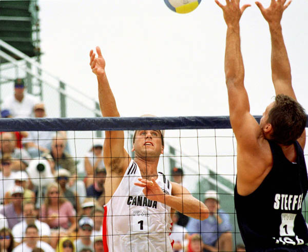 Canada's John Child (left) competes in the beach volleyball tournament at the 1996 Atlanta Olympic Games. (CP Photo/COA/F. Scott Grant)