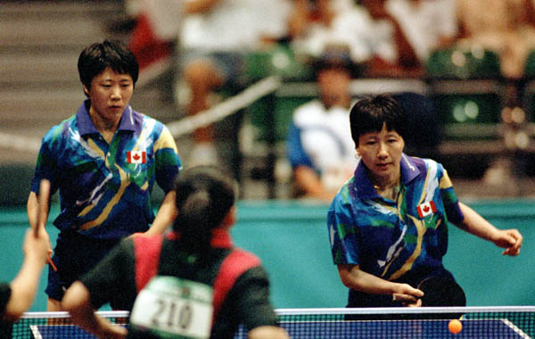 Canada's Barbara Chiu (right) and Lijuan Geng compete in the doubles table tennis event at the 1996 Atlanta Olympic Games. (CP Photo/COA/Scott Grant)