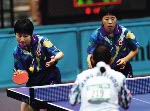 Canada's Lijuan Geng (blue) competes in the doubles table tennis event at the 1996 Atlanta Olympic Games. (CP Photo/COA/Scott Grant)
