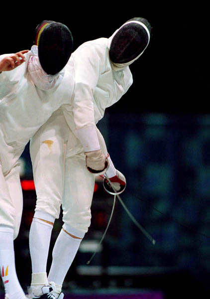 Canada's Jean-Marc Chouinard (right) competes in the fencing event at the 1996 Atlanta Summer Olympic Games. (CP Photo/ COA/F. Scott Grant)