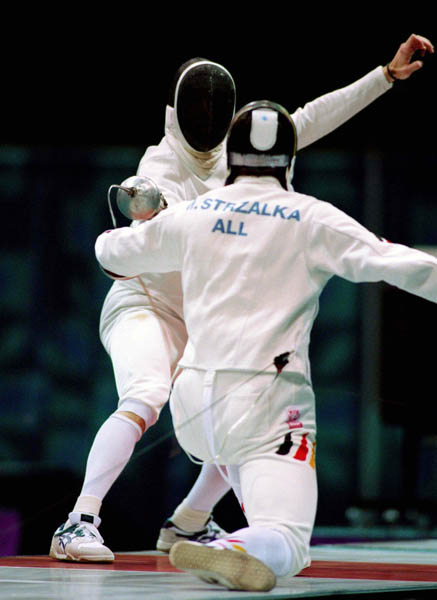 Canada's Jean-Marc Chouinard (left) competes in the fencing event at the 1996 Atlanta Summer Olympic Games. (CP Photo/ COA/F. Scott Grant)