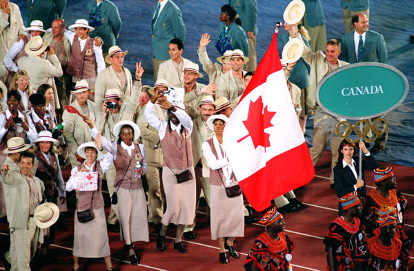 Canada's Charmaine Crooks carries the flag during the opening ceremony at the 1996 Atlanta Summer Olympic Games. (CP PHOTO/COA/Mike RIdewood)