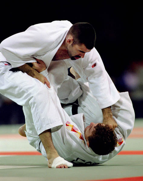 Canada's Nicolas Gill (left) competes in the judo event at the 1996 Atlanta Summer Olympic Games. (CP Photo/COA/F. Scott Grant)