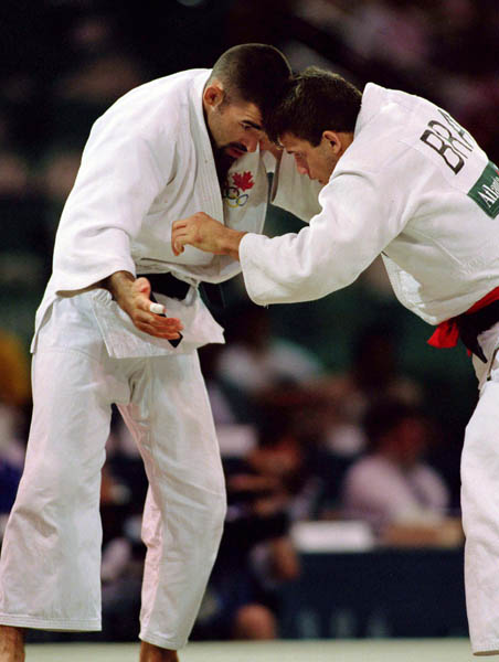 Canada's Nicolas Gill (left) competes in the judo event at the 1996 Atlanta Summer Olympic Games. (CP Photo/COA/F. Scott Grant)