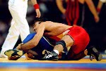 Canada's Oleg Ladik (left) competes in the wrestling event at the 1996 Atlanta Olympic Games. (CP Photo/COA/Mike Ridewood)