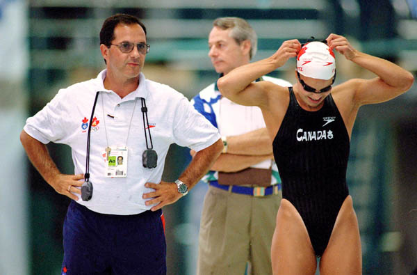 Canada's Tom Johnson (left) coaches during the swimming event at the 1996 Atlanta Summer Olympic Games. (CP Photo/COA/Mike Ridewood)