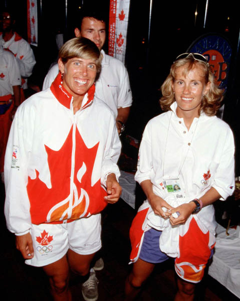 Canada's Silken Laumann (left) and Colleen Miller pose during the team reception at the 1996 Atlanta Olympics. (CP Photo/COA/Claus Andersen)