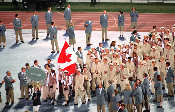Canada's Charmaine Crooks carries the Canadian flag during the opening ceremony at the 1996 Atlanta Summer Olympic Games. (CP Photo/COA/Mike RIdewood)