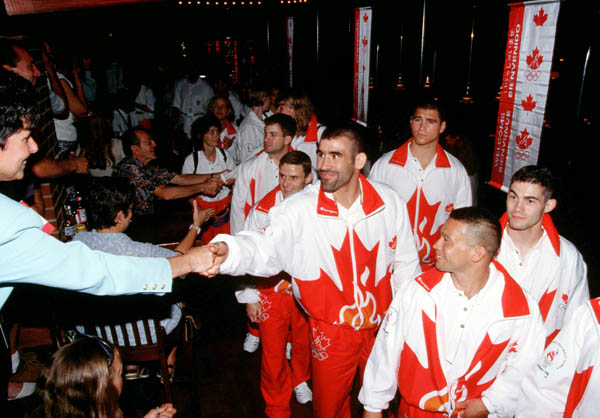 Canada's judo athlete Nicolas Gill (centre) attends the team reception during the 1996 Atlanta Olympics. (CP Photo/COA/Claus Andersen)