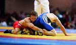 Canada's Craig Roberts (red) competes in the wrestling event at the 1996 Atlanta Olympic Games. (CP Photo/COA/Mike Ridewood)