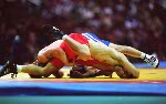 Canada's Craig Roberts (blue) competes in the wrestling event at the 1996 Atlanta Olympic Games. (CP Photo/COA/Mike Ridewood)