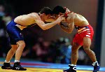 Canada's Craig Roberts (blue) competes in the wrestling event at the 1996 Atlanta Olympic Games. (CP Photo/COA/Mike Ridewood)