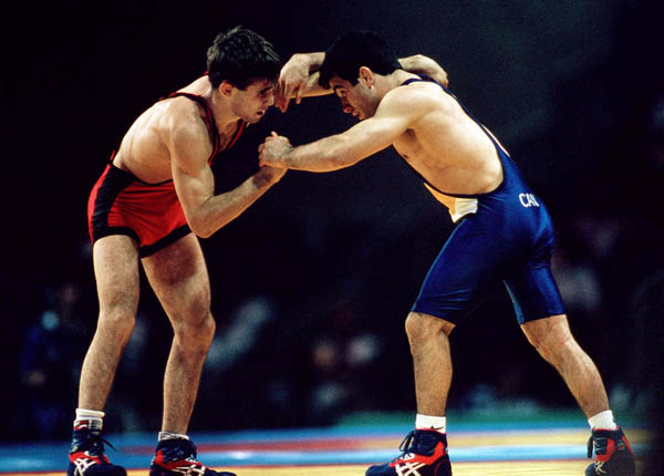 Canada's Guivi Sissaouri (right) competes in the wrestling event at the 1996 Atlanta Olympic Games. (CP Photo/COA/Mike Ridewood)