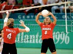 Canada's Katrina Vonsass (left) and Michelle Sawatzky participate in volleyball action at the 1996 Atlanta Olympic Games. (CP Photo/COA/F. Scott Grant)