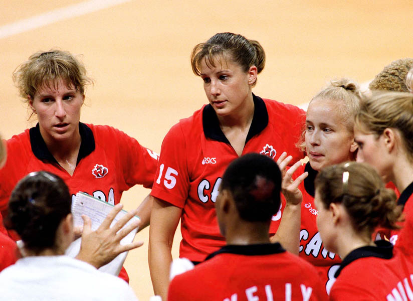 Canada's women's volleyball team listens to the coach at the 1996 Atlanta Olympic Games. (CP Photo/COA/F. Scott Grant)