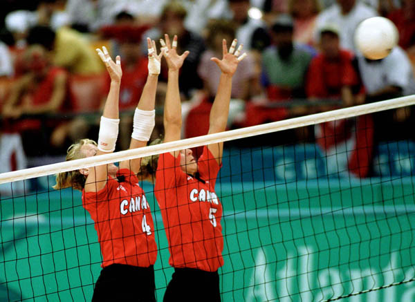Canada's Katrina Von Sass (left) and Brigitte Soucy participates in volleyball action at the 1996 Atlanta Olympic Games. (CP Photo/COA/F. Scott Grant)
