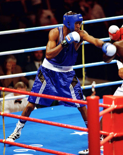 Canada's David Defiagbon competes in the boxing event at the 1996 Atlanta Summer Olympic Games. (CP Photo/COA/Scott Grant)