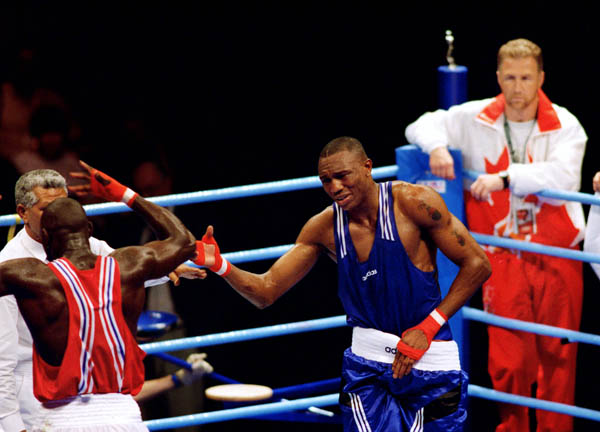 Canada's David Defiagbon (right) competes in the boxing event at the 1996 Atlanta Summer Olympic Games. (CP Photo/COA/Scott Grant)