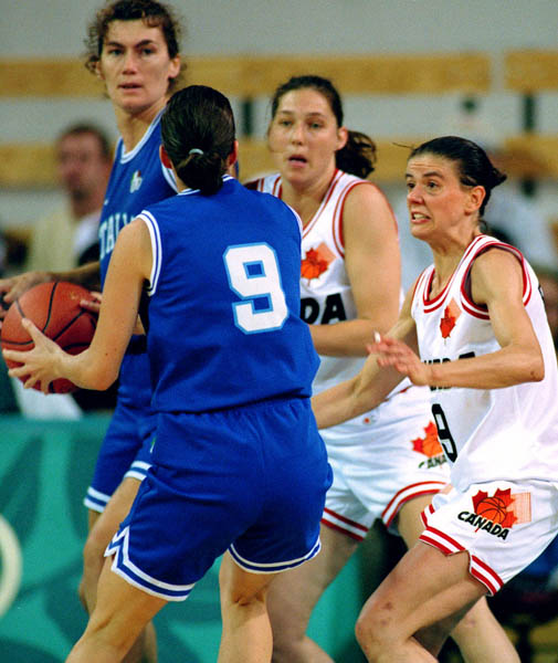 Canada's Dianne Norman (centre) and Jodi Evans (9) participate in women basketball action at the 1996 Atlanta Summer Olympic Games. (CP Photo/COA/Scott Grant)