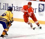 Canada's Greg Johnson (red) participates in hockey action at the 1994 Winter Olympics in Lillehammer. (CP Photo/COA/Claus Andersen)