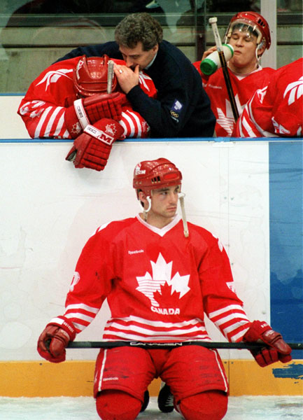 Canada's coach Tom Renney speaks to a player during hockey action at the 1994 Winter Olympics in Lillehammer. (CP Photo/COA/Claus Andersen)