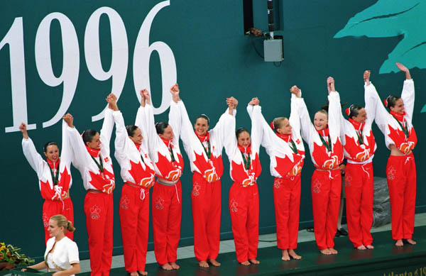 Canada's synchronized swimming team celebrates their silver medal win at the 1996 Atlanta Summer Olympic Games. (CP Photo/COA/Scott Grant)