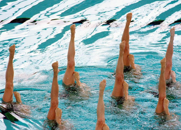 Canada's synchronized swimming team performs its routine at the 1996 Atlanta Summer Olympic Games. (CP Photo/COA/Scott Grant)