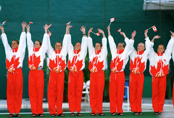 Canada's synchronized swimming team celebrates their silver medal win at the 1996 Atlanta Summer Olympic Games. (CP Photo/COA/Scott Grant)
