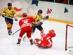 Canada's Corey Hirsch and Derek Mayer in action against Sweden at the 1994 Lillehammer Winter Olympics. (CP PHOTO/ COA)