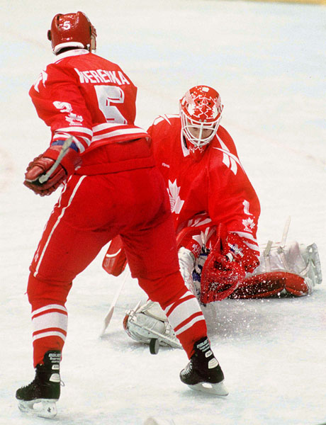 Canada's Brad Werenka (left) and Corey Hirsch compete in hockey action at the 1994 Winter Olympics in Lillehammer. (CP Photo/COA/Claus Andersen)