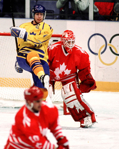 Canada's Corey Hirsch (goalie) competes in hockey action against Sweden at the 1994 Winter Olympics in Lillehammer. (CP Photo/COA/Claus Andersen)