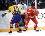 Canada's Fabian Joseph (right) competes in hockey action against Sweden at the 1994 Winter Olympics in Lillehammer. (CP Photo/COA/Claus Andersen)