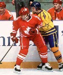 Canada's Chris Kontos (left) competes in hockey action against Sweden at the 1994 Winter Olympics in Lillehammer. (CP Photo/COA/Claus Andersen)