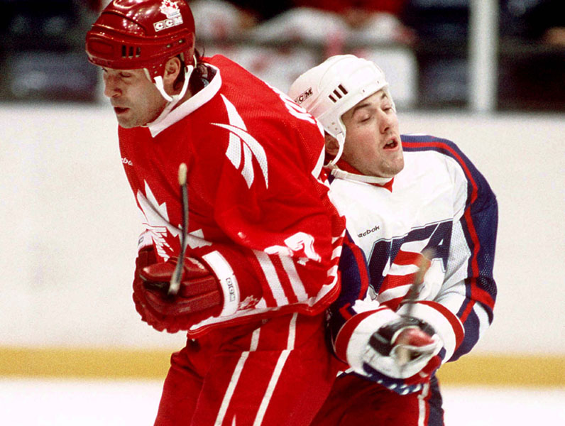 Canada's Chris Kontos (left) competes in hockey action against the United States at the 1994 Winter Olympics in Lillehammer. (CP Photo/COA/Claus Andersen)