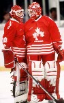 Canada's Ken Lovsin (left) and Corey Hirsch (goalie) compete in hockey action against Sweden at the 1994 Winter Olympics in Lillehammer. (CP Photo/COA/Claus Andersen)