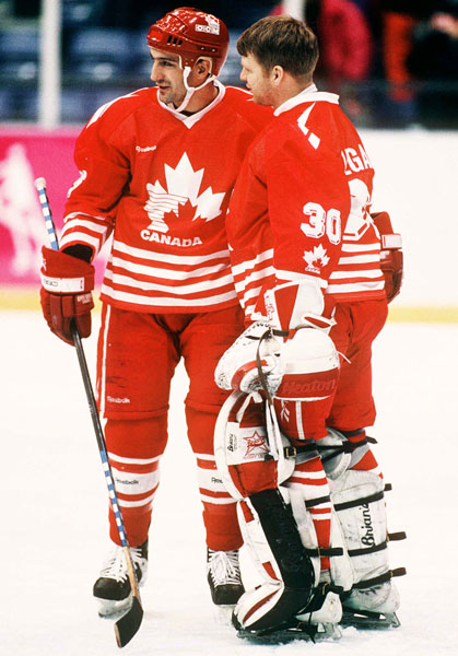 Canada's Jean-Yves Roy (left) and Manny Legace participate in hockey action at the 1994 Winter Olympics in Lillehammer. (CP Photo/COA/Claus Andersen)