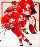 Canada's Ken Lovsin (left) and Brad Werenka compete in hockey action against Sweden at the 1994 Winter Olympics in Lillehammer. (CP Photo/COA/Claus Andersen)