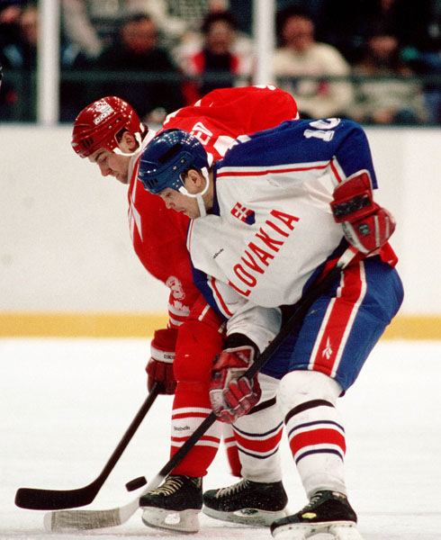 Canada's Petr Nedved (left) competes in hockey action against Slovakia at the 1994 Winter Olympics in Lillehammer. (CP Photo/COA/Claus Andersen)