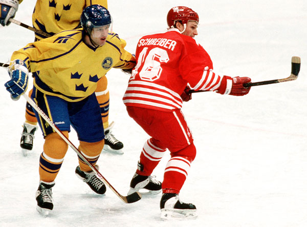 Canada's Wally Schreiber competes in hockey action against Sweden at the 1994 Winter Olympics in Lillehammer. (CP Photo/COA/Claus Andersen)