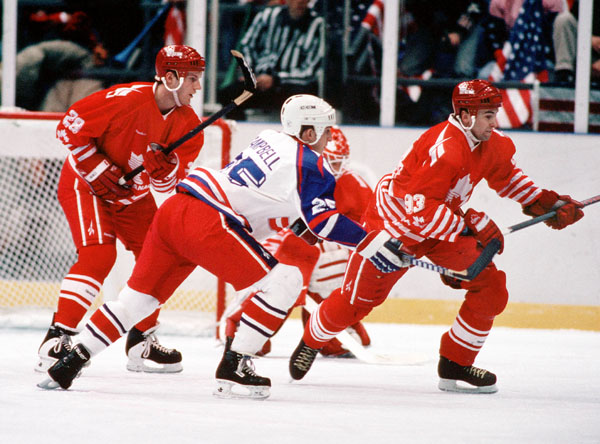 Canada's David Harlock (left) and Petr Nedved compete in hockey action against the united States at the 1994 Winter Olympics in Lillehammer. (CP Photo/COA/Claus Andersen)