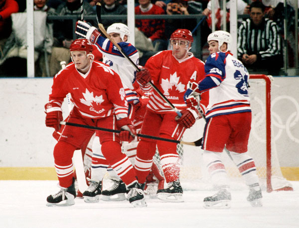 Canada's David Harlock (left) and Jean-Yves Roy compete in hockey action at the 1994 Winter Olympics in Lillehammer. (CP Photo/COA/Claus Andersen)
