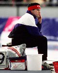 Canada's Sylvain Bouchard (left) and coach Robert Tremblay talk during the long track speed skating event at the 1994 Lillehammer Winter Olympics. (CP Photo/ COA/F. Scott Grant)