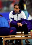 Canada's Sylvain Bouchard (left) and coach Robert Tremblay talk during the long track speed skating event at the 1994 Lillehammer Winter Olympics. (CP Photo/ COA/F. Scott Grant)