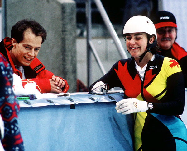 Canada's figure skater Kurt Browning and short track speed skater Angela Cutrone laugh at the 1994 Lillehammer Winter Olympics. (CP Photo/COA/F. Scott Grant)