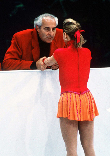 Canada's Jose Chouinard listens to her coach Louis Stong during figure skating competition at the 1994 Lillehammer Winter Olympics. (CP PHOTO/ COA)