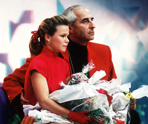 Canada's Jose Chouinard waits for her score with her coach Louis Stong during figure skating competition at the 1994 Lillehammer Winter Olympics. (CP PHOTO/ COA)