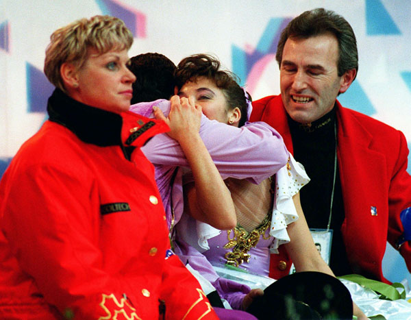 Canada's Isabelle Brasseur and Lloyd Eisler celebrate their score in the pairs figure skating event at the 1994 Lillehammer Winter Olympics. (CP Photo/COA/F. Scott Grant)