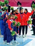 Canada's women's relay team (Left to Right) Isabelle Charest, Christine Boudrais, Tania Vincent and Annie Perreault celebrate  after winning the bronze  medal in the women's short track speed skating relay event at the 1998 Nagano Olympic Games.  (CP Photo/COA)